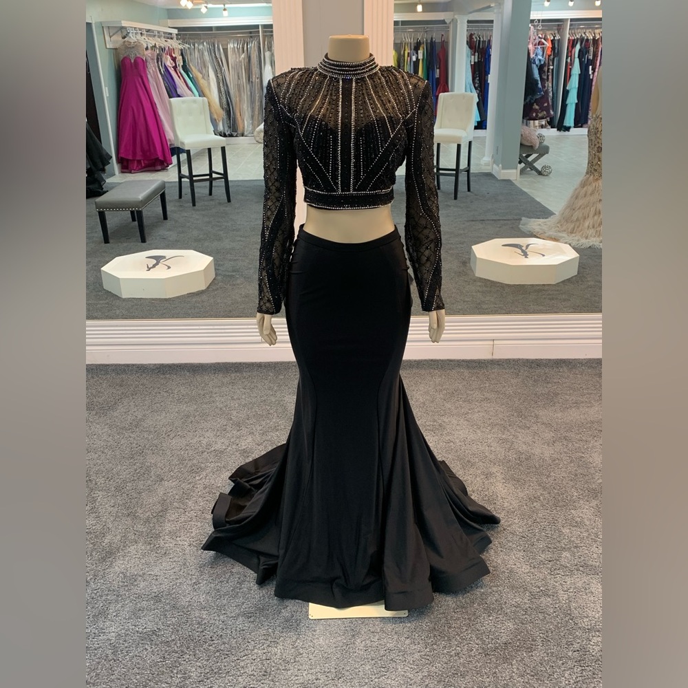 Size 12. black. 2 piece. trumpet bottom. long sleeve top beaded. keyhole cutout